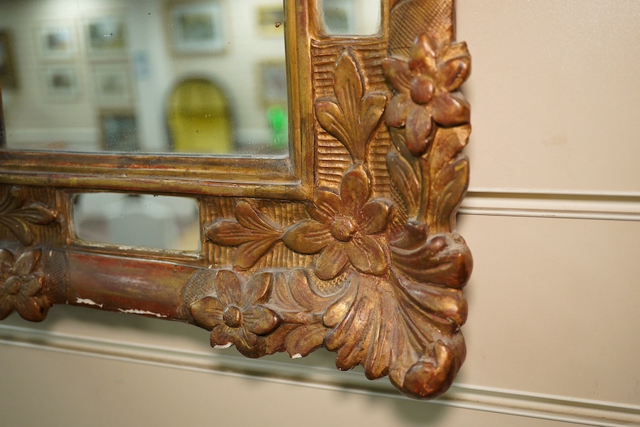 A Victorian gilt gesso mirror with chimney sweep's guild crest. Condition - poor to fair